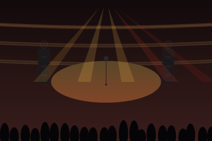 Escenario vacío de auditorio con micrófono, luces ámbar y rojas e iluminación de concierto